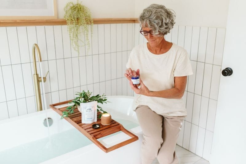 A woman using Pure CBD Cream